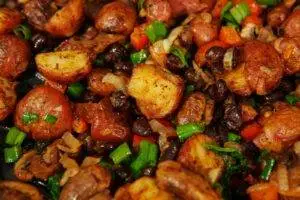 A close up of a plate of food with meat and vegetables